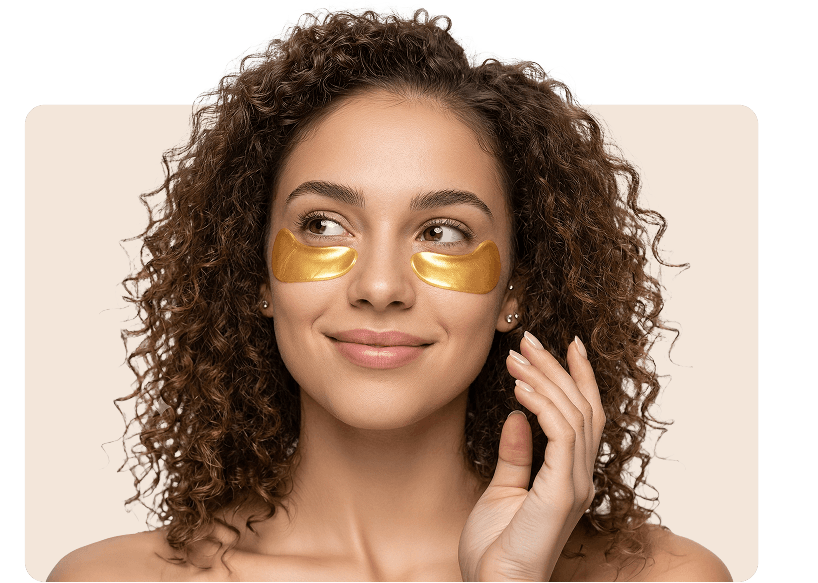 Model wearing a luminous gold eye mask